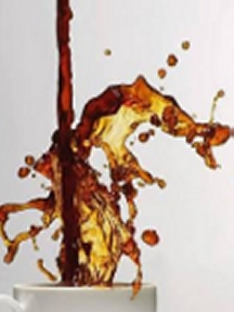 Coffee cascading up out of cup